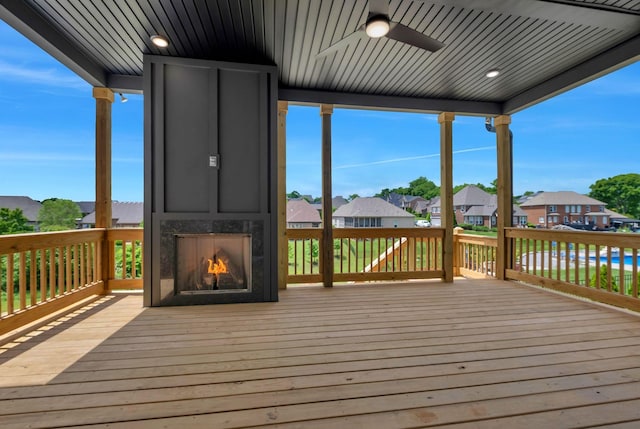 1018 Keeneland Dr, Gallatin, TN 37066 - wooden terrace featuring a fireplace, a residential view, and a ceiling fan