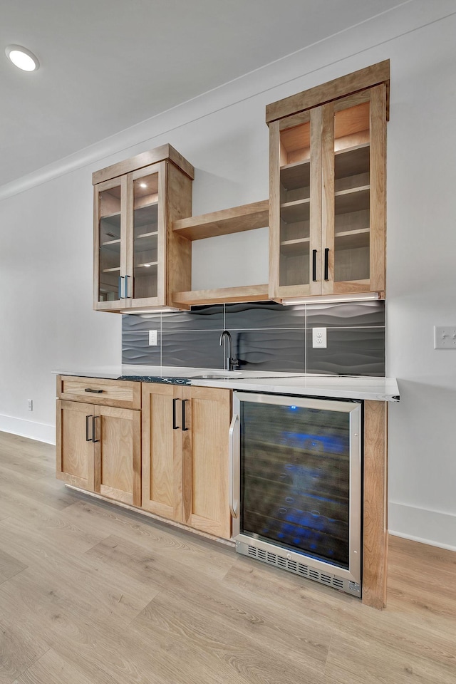 1018 Keeneland Dr, Gallatin, TN 37066 - bar area featuring beverage cooler, baseboards, light wood-style flooring, tasteful backsplash, and ornamental molding