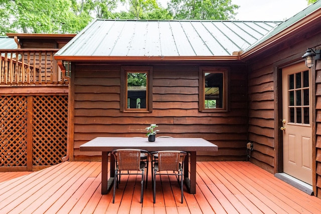 wooden deck with outdoor dining space