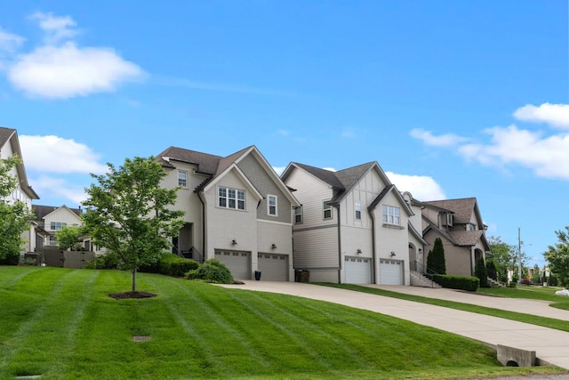 view of property featuring a garage, concrete driveway, a front yard, and board and batten siding