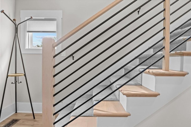 stairway with wood finished floors