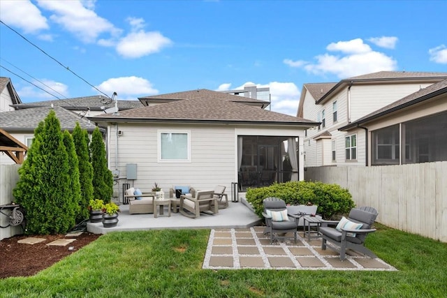 rear view of house with a sunroom, an outdoor living space, and a patio