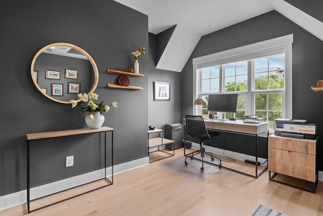 office with wood finished floors, lofted ceiling, and baseboards