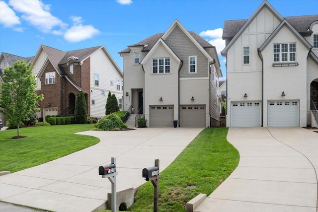 view of front facade with an attached garage, concrete driveway, a front lawn, and a residential view