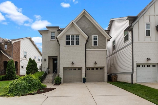 view of front facade featuring concrete driveway, brick siding, and an attached garage