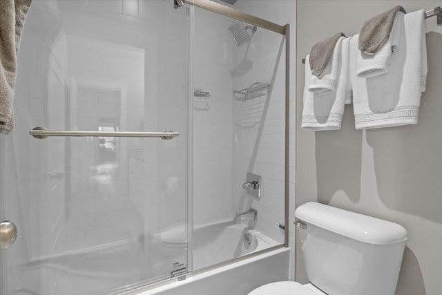bathroom with toilet and enclosed tub / shower combo