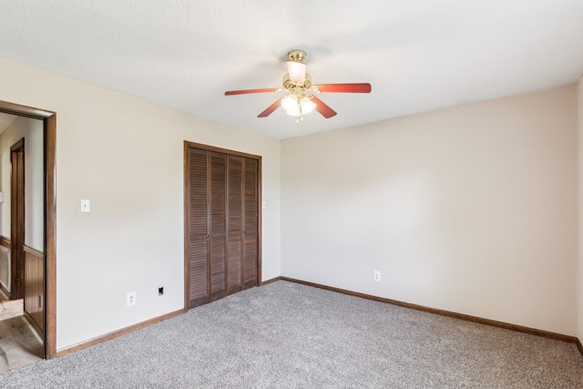 5245 Galen Rd, Lafayette, TN 37083 - unfurnished bedroom with carpet flooring, a closet, baseboards, and a ceiling fan