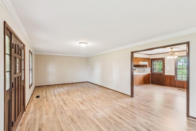 5245 Galen Rd, Lafayette, TN 37083 - spare room featuring light wood finished floors, ornamental molding, a wainscoted wall, and wood walls