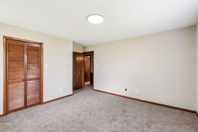 5245 Galen Rd, Lafayette, TN 37083 - unfurnished bedroom featuring carpet, baseboards, and a closet