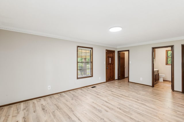5245 Galen Rd, Lafayette, TN 37083 - empty room with light wood-type flooring, crown molding, and baseboards