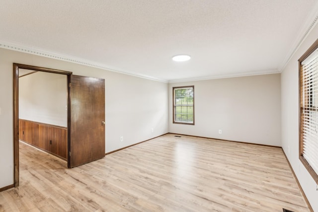 5245 Galen Rd, Lafayette, TN 37083 - unfurnished bedroom with light wood-style floors, crown molding, and baseboards