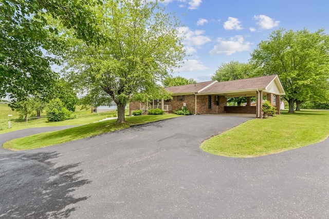 5245 Galen Rd, Lafayette, TN 37083 - view of front of property with driveway, a front yard, brick siding, and a carport
