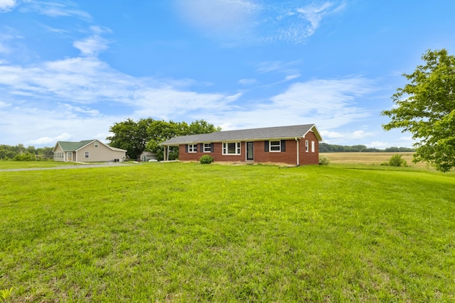 single story home featuring a front lawn and brick siding