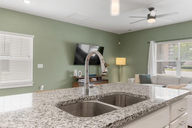 895 Industrial Dr, Old Hickory, TN 37138 - kitchen featuring a sink, light stone counters, white cabinetry, and ceiling fan
