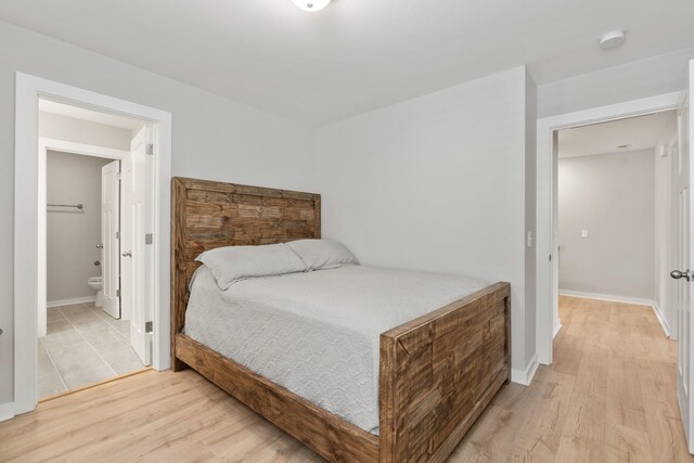 895 Industrial Dr, Old Hickory, TN 37138 - bedroom with light wood finished floors, baseboards, and ensuite bathroom