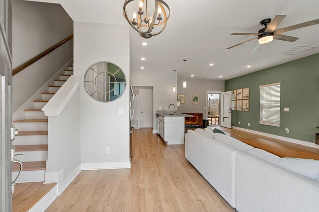 895 Industrial Dr, Old Hickory, TN 37138 - living room with light wood-style flooring, ceiling fan, stairway, recessed lighting, and a chandelier