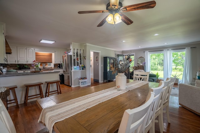 dining room with ceiling fan, wood finished floors, recessed lighting, and crown molding