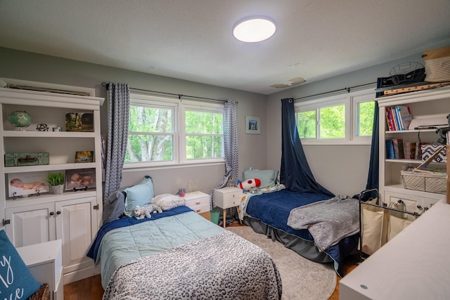 bedroom featuring wood finished floors