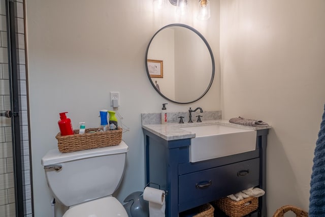 bathroom with toilet and vanity