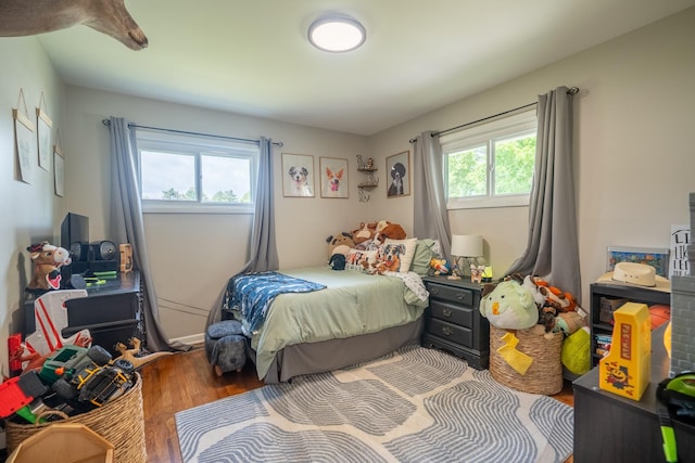 bedroom with wood finished floors