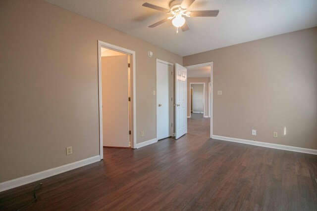587 Joshua Dr, Clarksville, TN 37042 - empty room featuring a ceiling fan, dark wood-type flooring, and baseboards