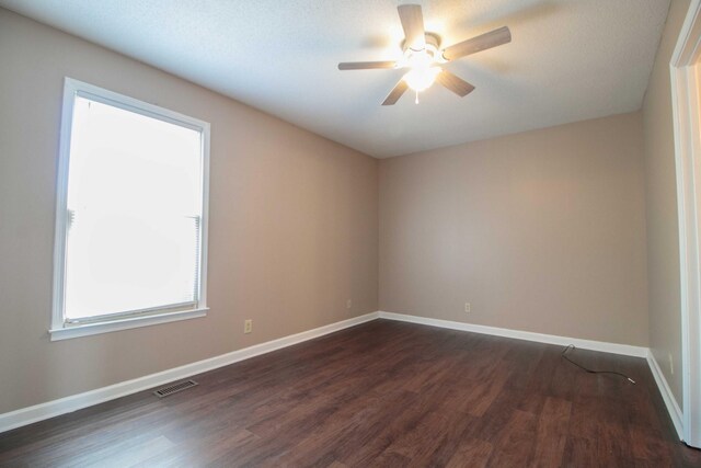 587 Joshua Dr, Clarksville, TN 37042 - empty room featuring dark wood-style flooring, ceiling fan, and baseboards