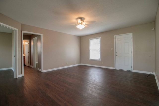 587 Joshua Dr, Clarksville, TN 37042 - empty room featuring ceiling fan, dark wood-style floors, and baseboards