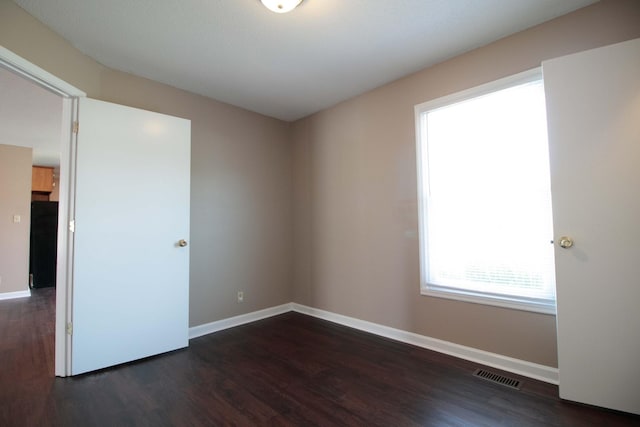 587 Joshua Dr, Clarksville, TN 37042 - empty room with wood finished floors and baseboards