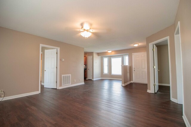 587 Joshua Dr, Clarksville, TN 37042 - unfurnished living room with dark wood-style floors and baseboards