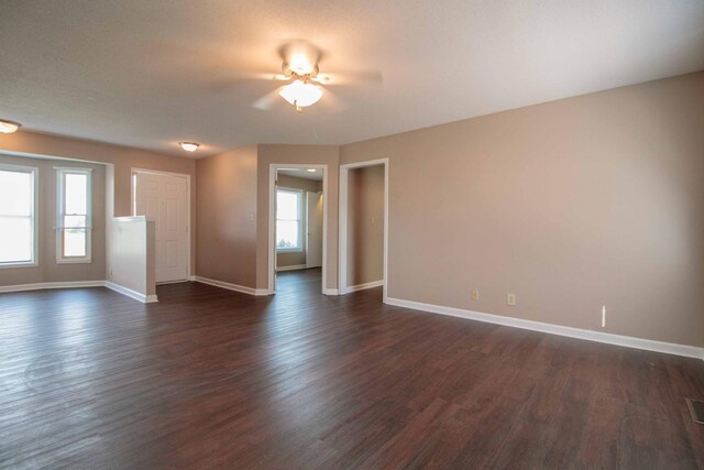 587 Joshua Dr, Clarksville, TN 37042 - unfurnished room with plenty of natural light, baseboards, and dark wood-style flooring