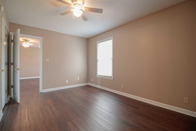 587 Joshua Dr, Clarksville, TN 37042 - spare room featuring ceiling fan, dark wood-style floors, and baseboards