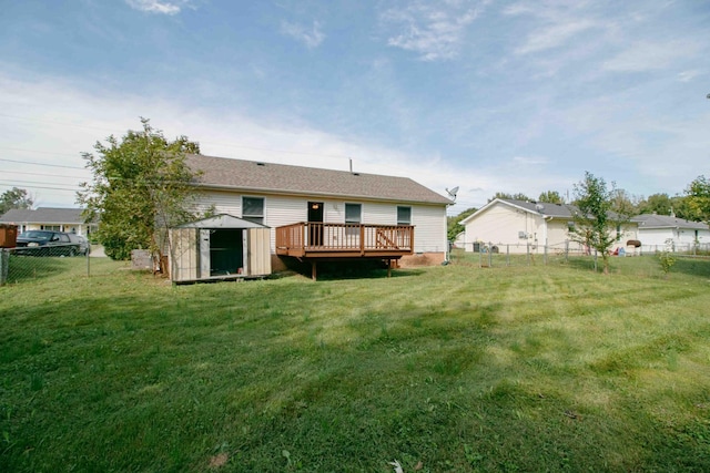 587 Joshua Dr, Clarksville, TN 37042 - rear view of property featuring a storage shed, a wooden deck, and an outbuilding