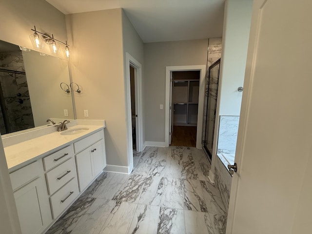 2301 Rockweather Ct, Murfreesboro, TN 37128 - full bath featuring baseboards, marble look tiles, a shower stall, vanity, and a spacious closet