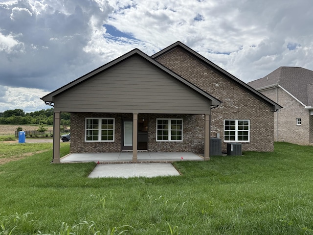 2301 Rockweather Ct, Murfreesboro, TN 37128 - rear view of property with a patio area, a yard, and brick siding