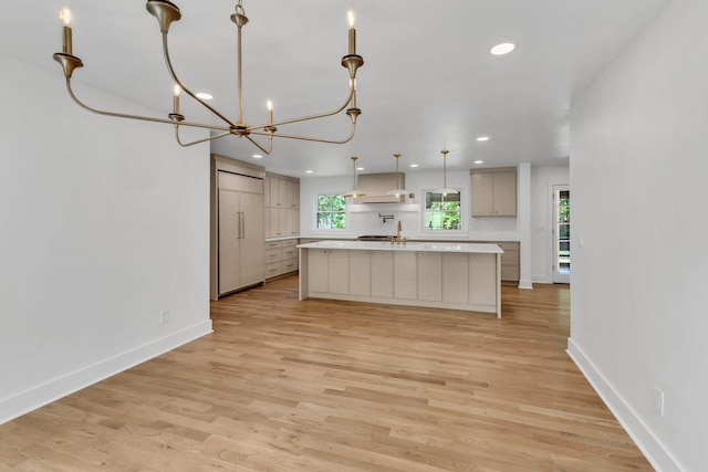 2513 Hillsboro Rd, Franklin, TN 37069 - kitchen featuring paneled built in fridge, light countertops, range hood, recessed lighting, and baseboards