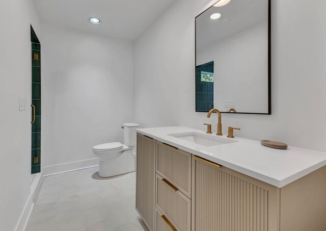 2513 Hillsboro Rd, Franklin, TN 37069 - bathroom featuring toilet, baseboards, tile patterned flooring, vanity, and recessed lighting