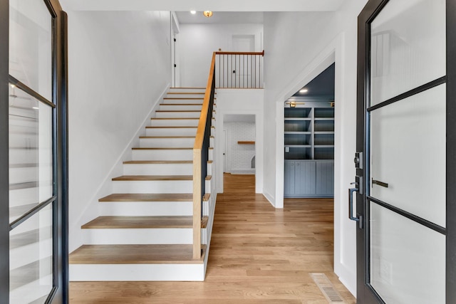 2513 Hillsboro Rd, Franklin, TN 37069 - entrance foyer featuring light wood-type flooring, stairway, and baseboards