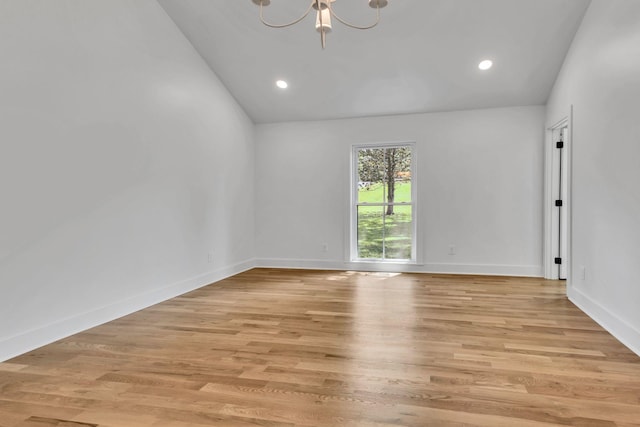 2513 Hillsboro Rd, Franklin, TN 37069 - unfurnished room featuring lofted ceiling, a chandelier, light wood finished floors, recessed lighting, and baseboards