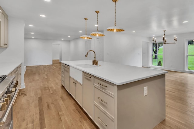2513 Hillsboro Rd, Franklin, TN 37069 - kitchen with a sink, an island with sink, double oven range, light wood finished floors, and recessed lighting