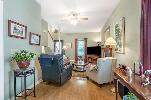 705 W Statue Ct, Franklin, TN 37067 - living area featuring light wood finished floors, stairway, a ceiling fan, and baseboards