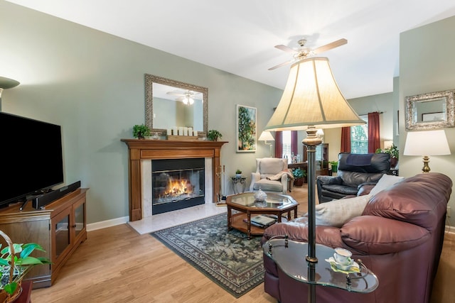 705 W Statue Ct, Franklin, TN 37067 - living area with a ceiling fan, light wood-style floors, a glass covered fireplace, and baseboards