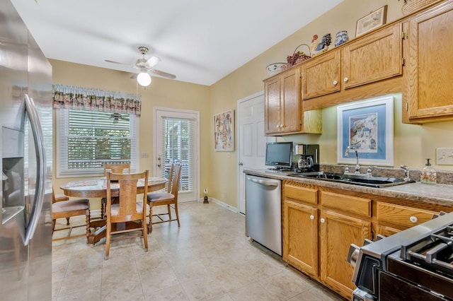 705 W Statue Ct, Franklin, TN 37067 - kitchen featuring appliances with stainless steel finishes, a sink, ceiling fan, and baseboards