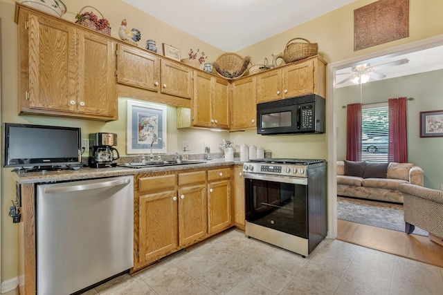 705 W Statue Ct, Franklin, TN 37067 - kitchen with stainless steel appliances, a sink, ceiling fan, and light countertops