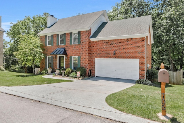 705 W Statue Ct, Franklin, TN 37067 - colonial home with a chimney, driveway, brick siding, a front lawn, and an attached garage