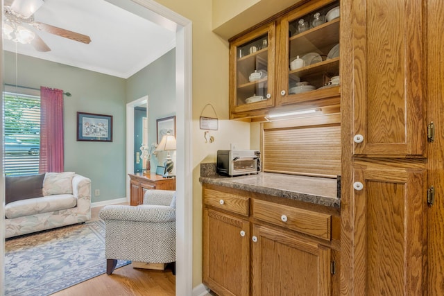 705 W Statue Ct, Franklin, TN 37067 - bar featuring ceiling fan, light wood finished floors, baseboards, and ornamental molding