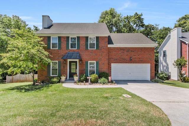 705 W Statue Ct, Franklin, TN 37067 - colonial-style house featuring a chimney, concrete driveway, brick siding, and a garage