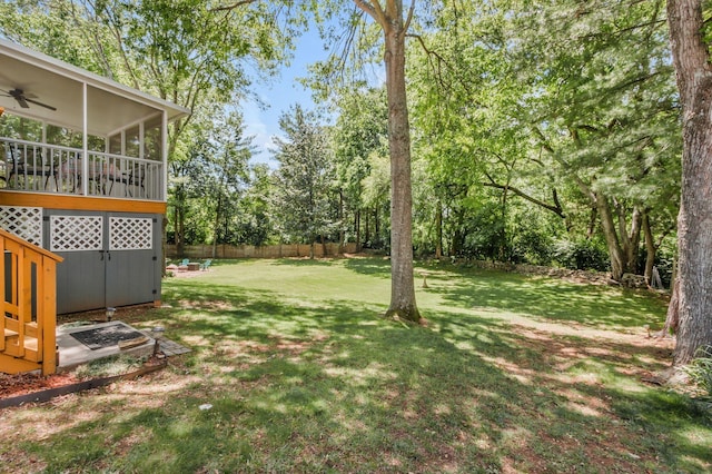 705 W Statue Ct, Franklin, TN 37067 - view of yard featuring a sunroom, ceiling fan, and view of wooded area