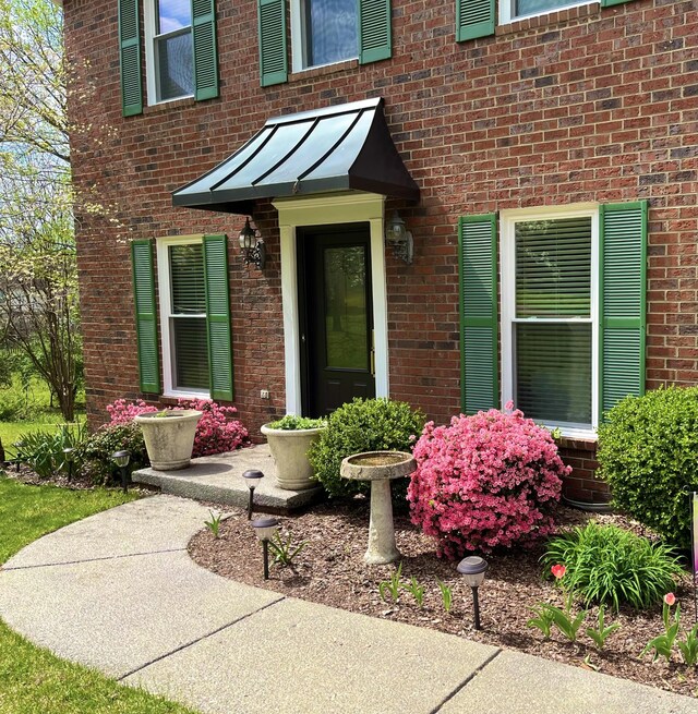 705 W Statue Ct, Franklin, TN 37067 - doorway to property with brick siding