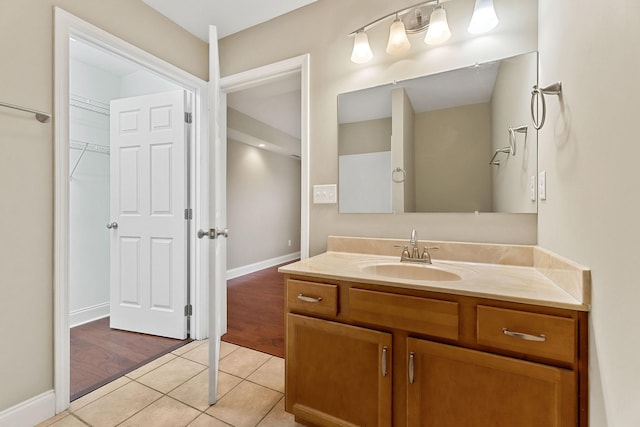 1643 Bobby Nichols Dr, Cookeville, TN 38506 - bathroom with vanity, tile patterned floors, baseboards, and a spacious closet