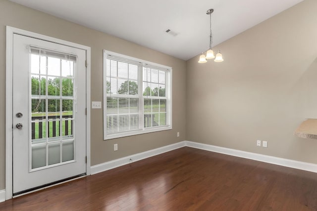 1643 Bobby Nichols Dr, Cookeville, TN 38506 - unfurnished dining area featuring dark wood finished floors, healthy amount of natural light, vaulted ceiling, and baseboards